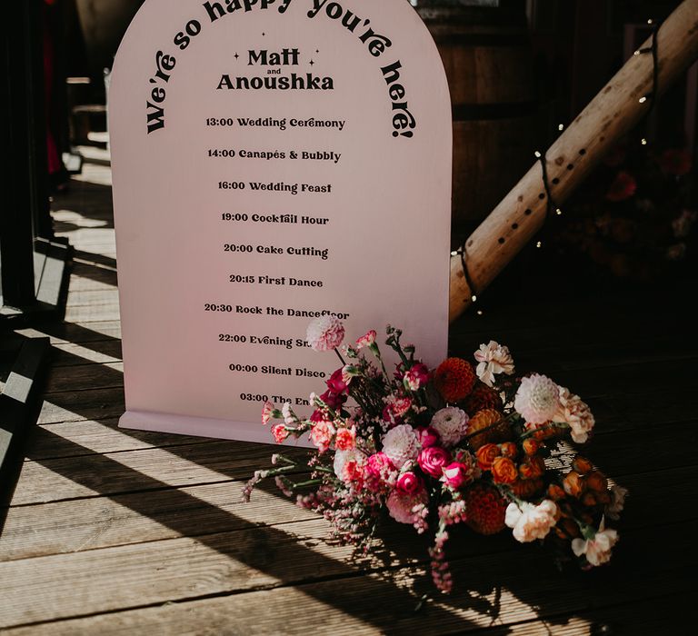 arched-wedding-order-of-the-day-sign