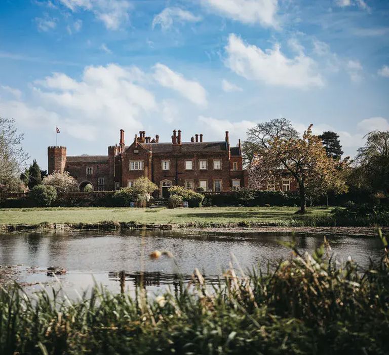 hodsock priory nottinghamshire wedding venue with view of exterior and lake