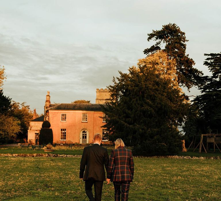 couple on their wedding day on the grounds on langar wedding venue in nottinghamshire