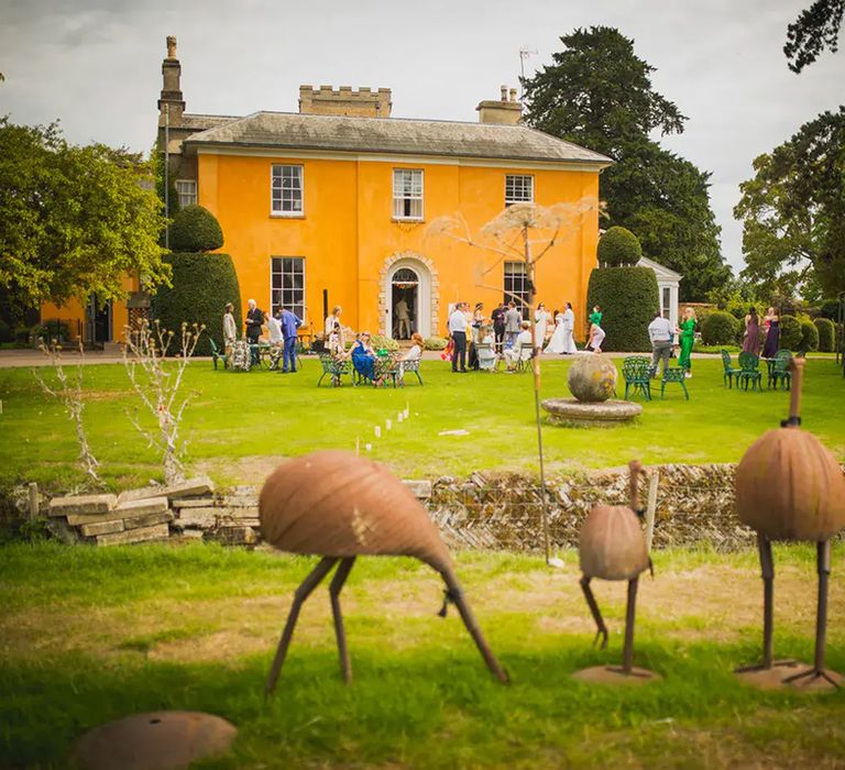 view of langar hall mustard-coloured wedding venue exterior and grounds 