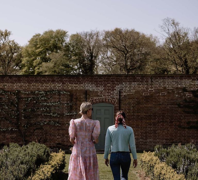 the walled garden in nottinghamshire, wedding venue grounds with guests taking a stroll