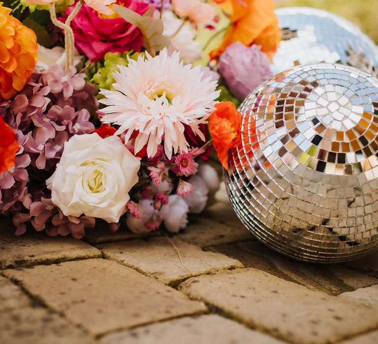 disco-balls-with-colourful-wedding-flower-decorations