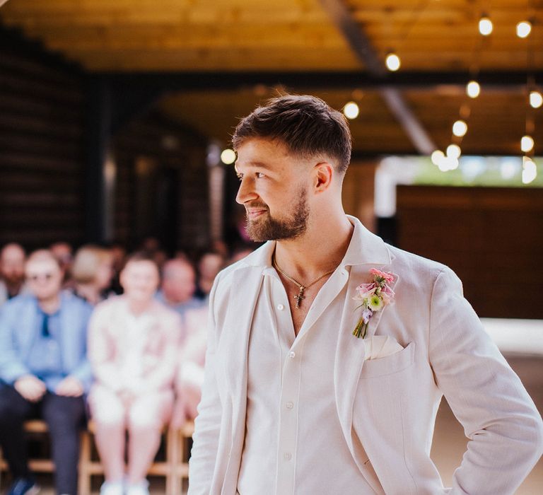 groom-in-white-suit