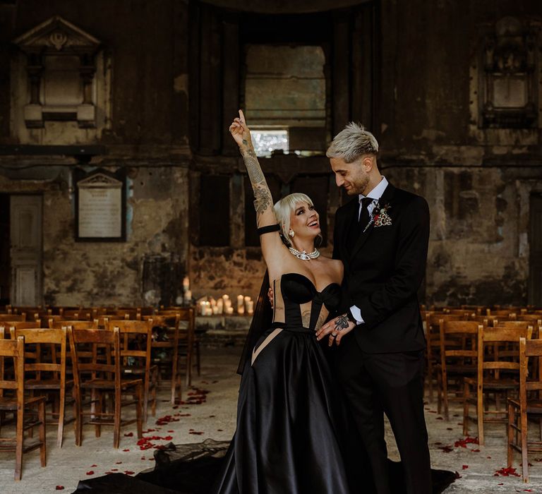 bride-and-groom-pose-in-all-black-wedding-outfits