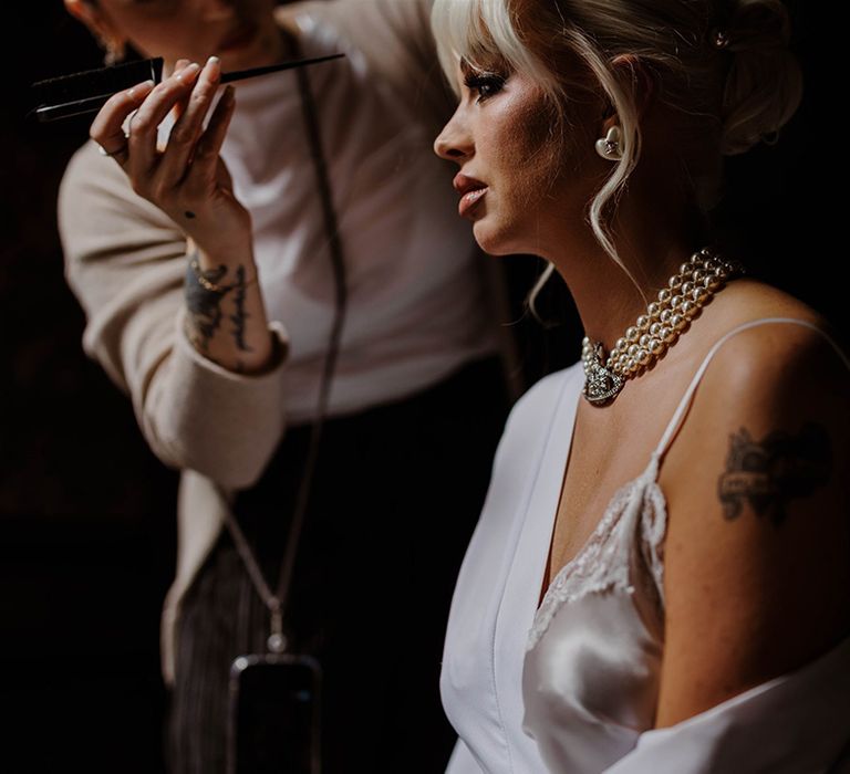 bride-getting-makeup-done-for-wedding