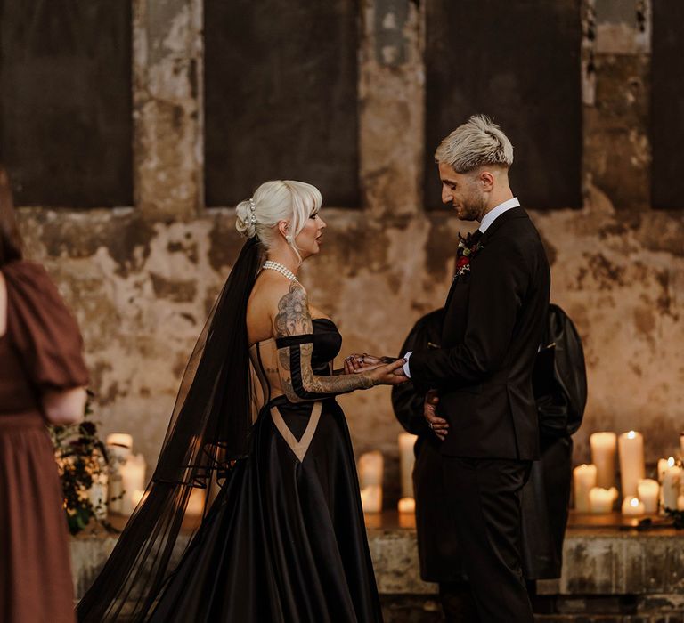 bride-with-black-wedding-dress-and-black-veil-with-groom-in-black-suit