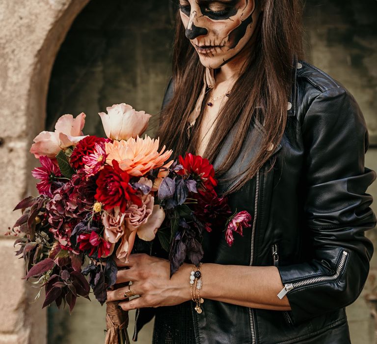 bride-in-leather-jacket-with-dia-de-los-muertos-face-makeup