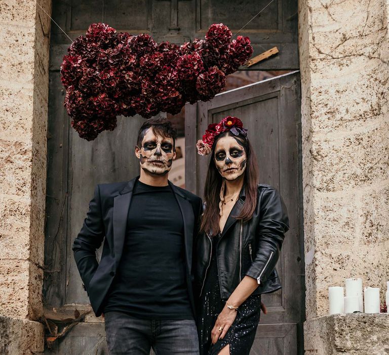 dark-red-hydrangea-cloud-decoration-with-couple-in-all-black