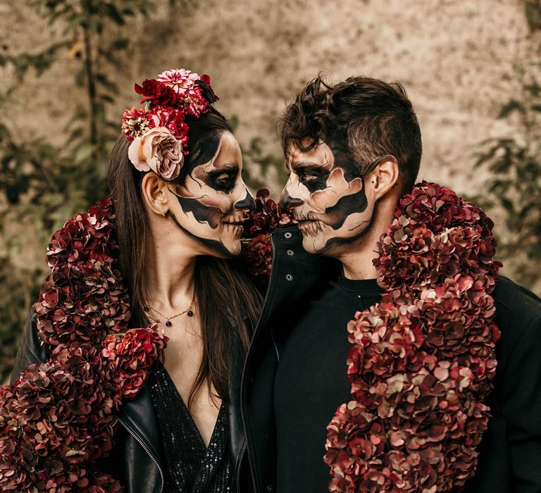 dia-de-los-muertos-wedding-inspiration-with-hyrdrangeas-draped-over-bride-and-groom