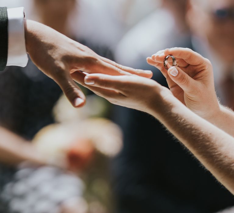 bride-puts-on-grooms-wedding-ring