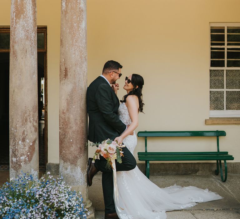 mermaid-wedding-dress-with-groom-in-green-wedding-suit