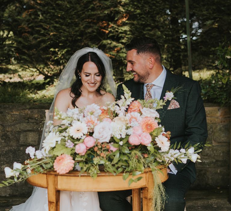 pink-and-cream-wedding-flowers-at-outdoor-wedding