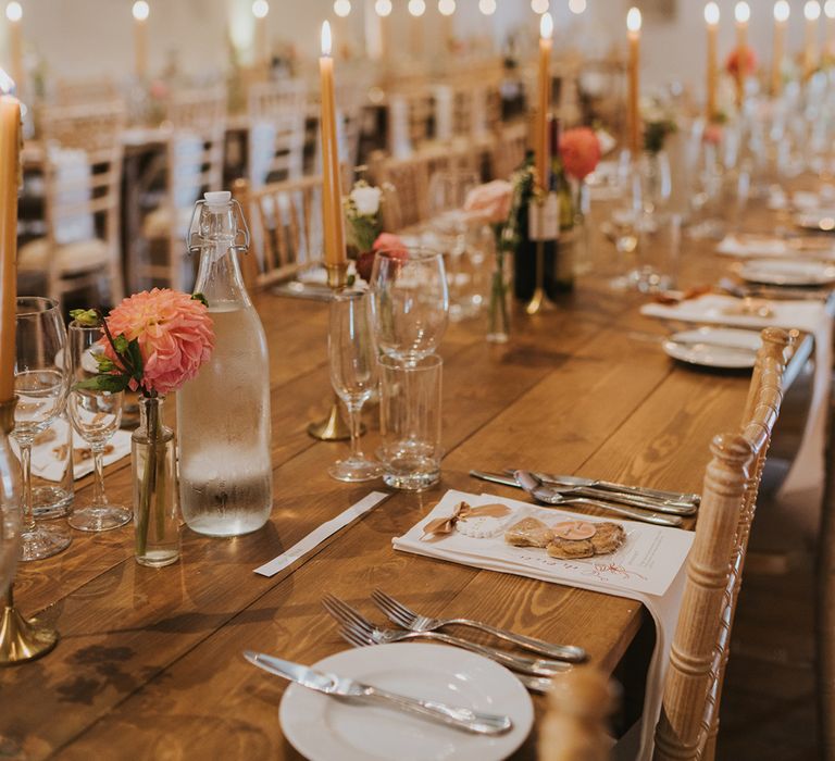 pink-wedding-flowers-and-candles-at-rustic-barn-wedding