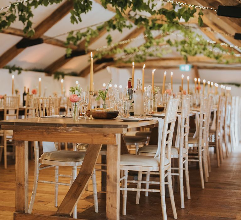 rustic-wedding-venue-with-pink-flowers-and-candles