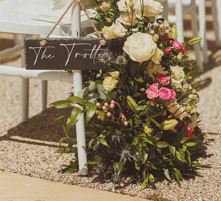 aisle-flowers-with-chalkboard-signage