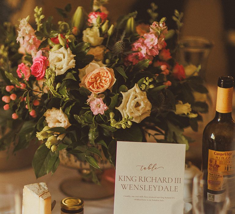 wedding-table-name-sign-with-cheese-table-centrepiece