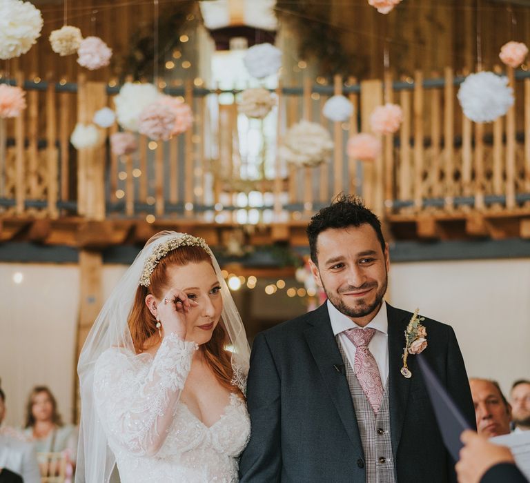 bride-gets-emotional-during-wedding-ceremony-at-barn-wedding