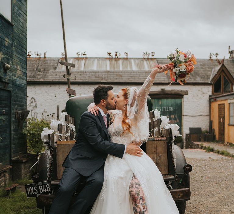 groom-kisses-bride-at-wedding-in-wales