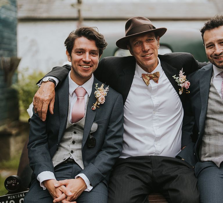 groom-with-immediate-family-at-wedding