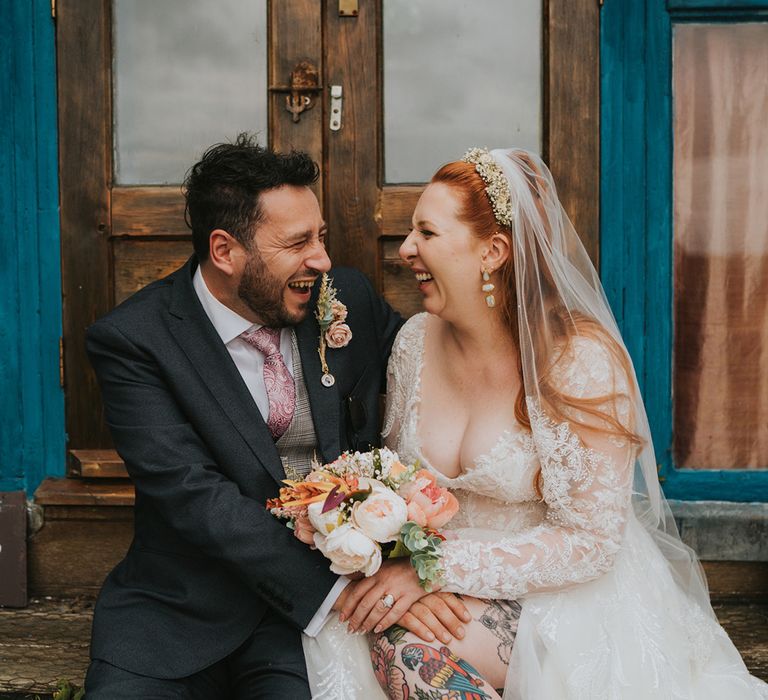 tattooed-bride-laughing-with-groom