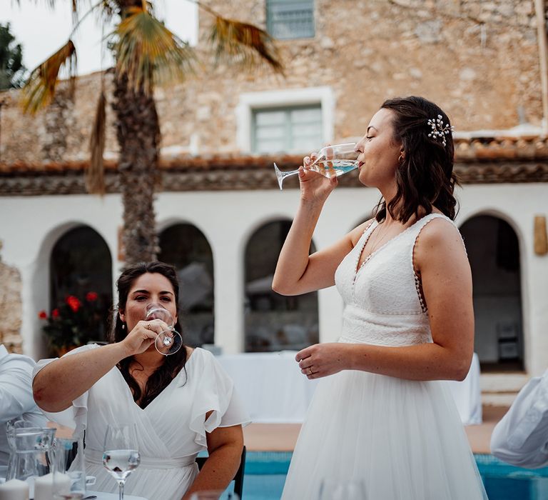 bride-drinks-as-a-toast-during-the-wedding