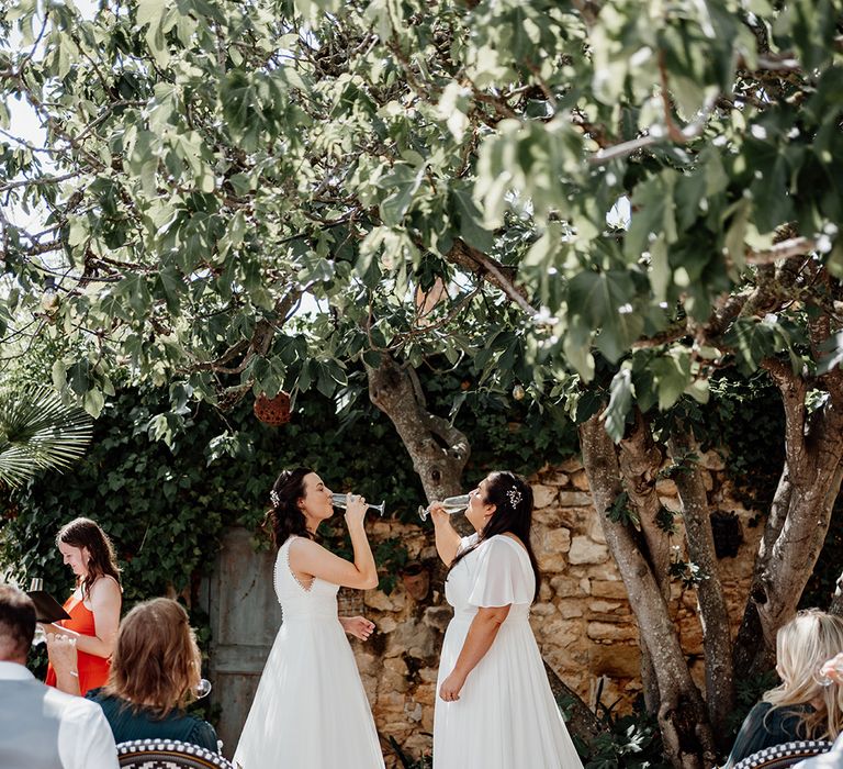 brides-drink-champagne-to-celebrate-being-married