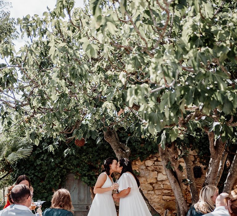 brides-share-first-kiss-as-married-couple