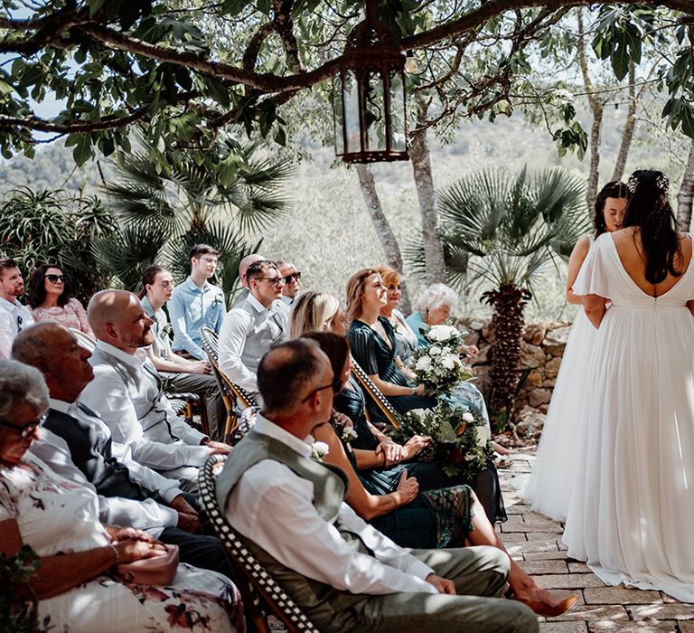 romantic-vow-exchange-under-tree-at-outdoor-wedding