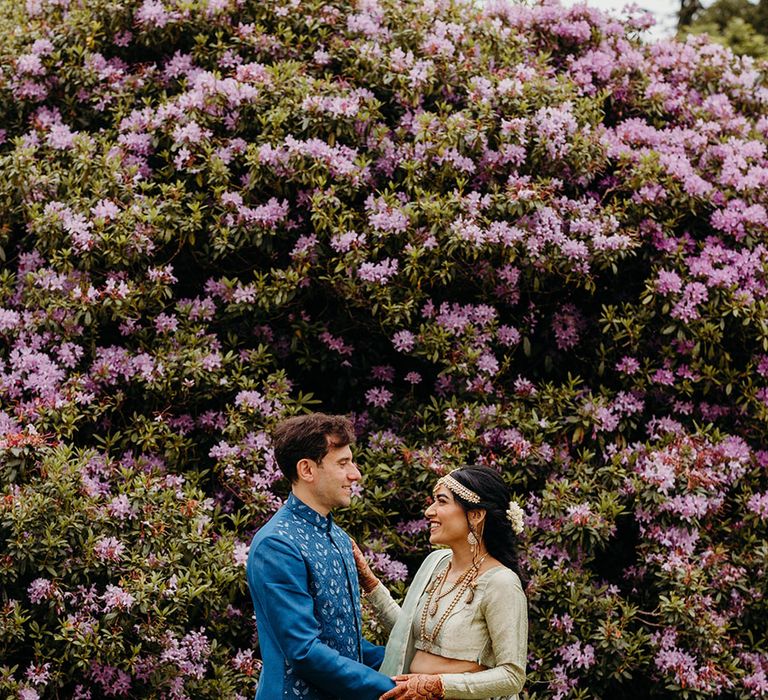 bride-and-groom-in-blue-and-green-traditional-outfits