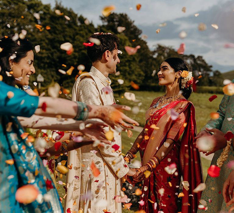 colourful-confetti-moment-for-bride-and-groom-at-wedding