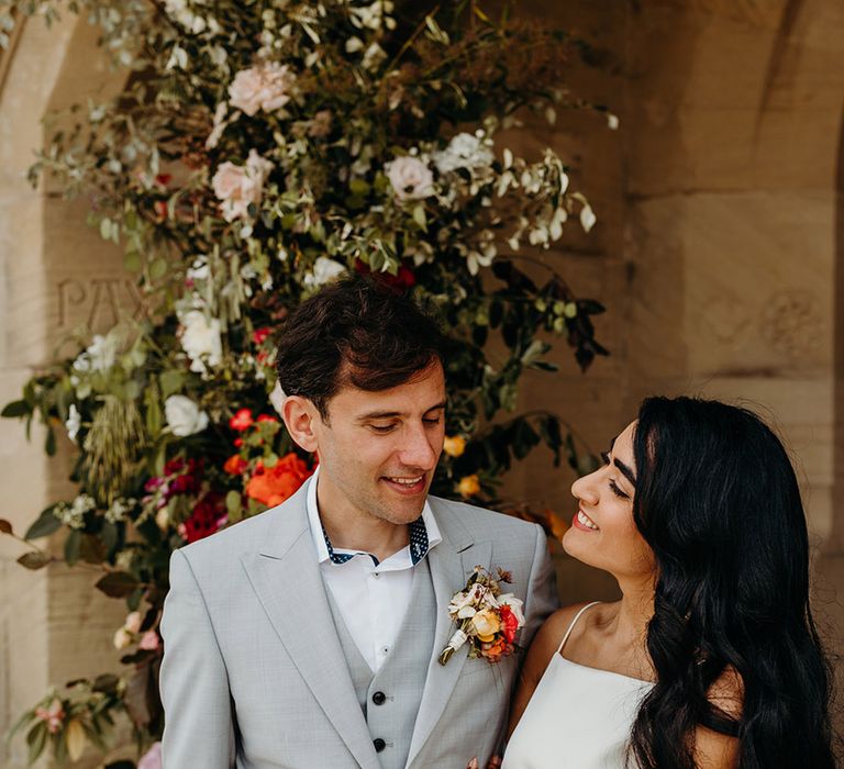 groom-in-light-grey-wedding-suit-with-bride-in-simple-wedding-dress-for-weekend-wedding