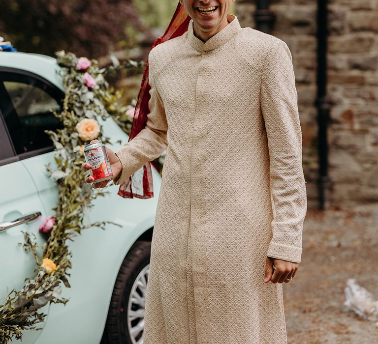 groom-wearing-sunglasses-and-cream-sherwani-for-hindu-wedding