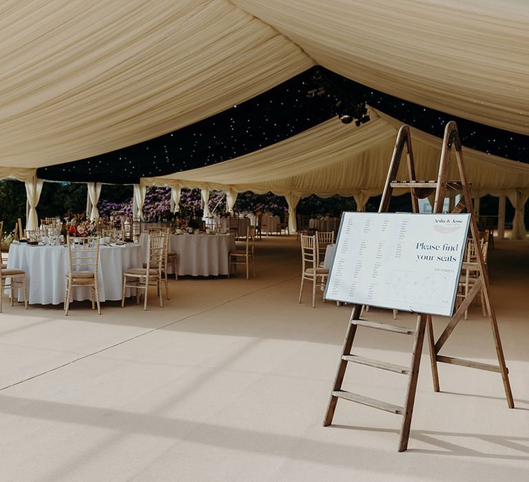 plas-dinam-marquee-wedding-with-seating-chart-sign