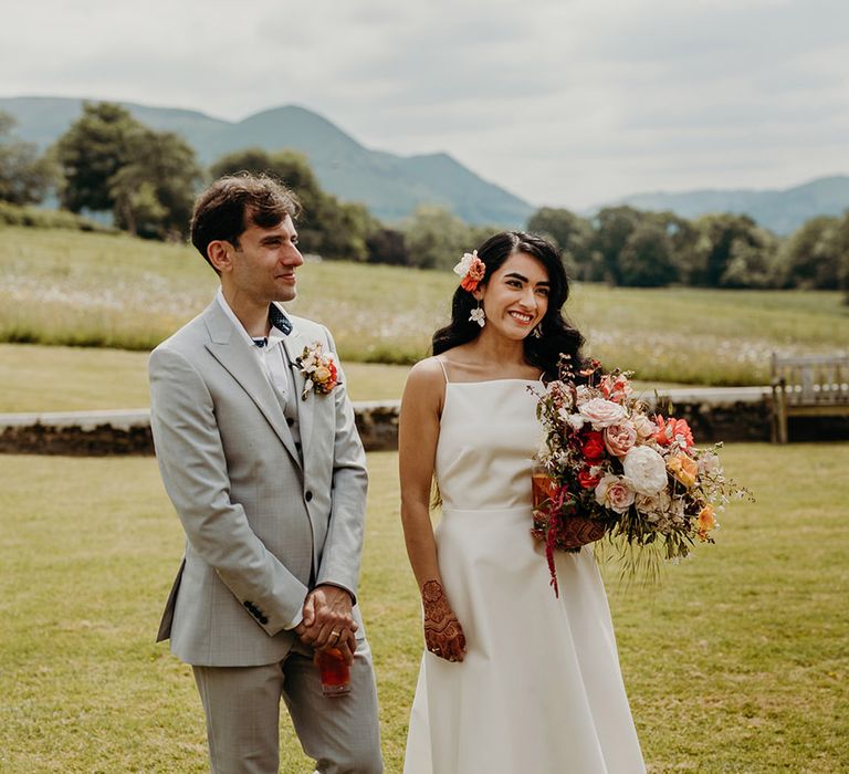 romantic-couple-portrait-with-groom-in-grey-wedding-suit