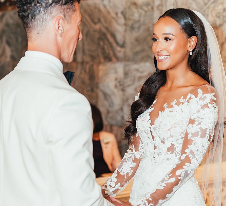 bride-smiling-at-groom-at-real-wedding-ceremony