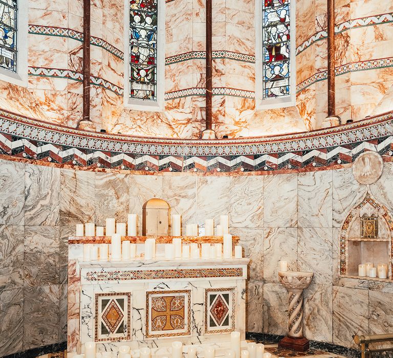 church-altar-decorated-with-candles-for-wedding-ceremony