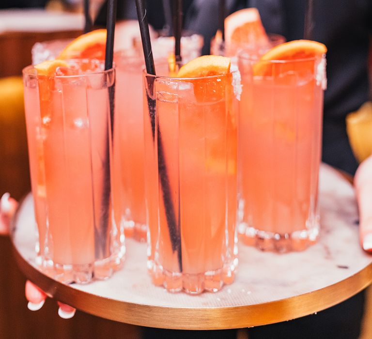 glasses-of-cocktails-with-black-paper-straws