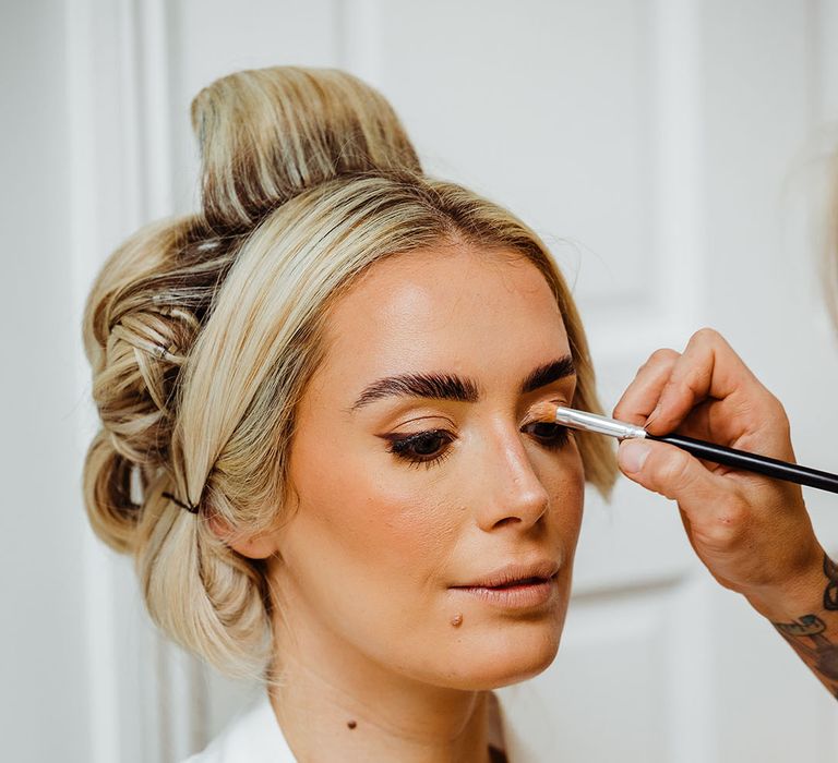 bride-gets-makeup-done-for-wedding-day