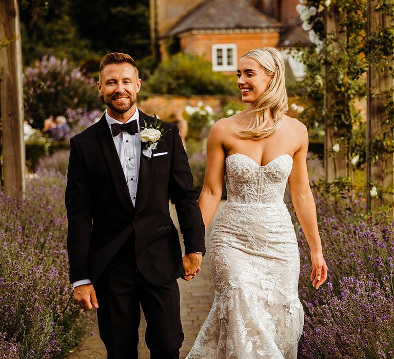 bride-in-strapless-lace-wedding-dress-with-groom-in-black-tuxedo-at-syrencot-wedding-venue