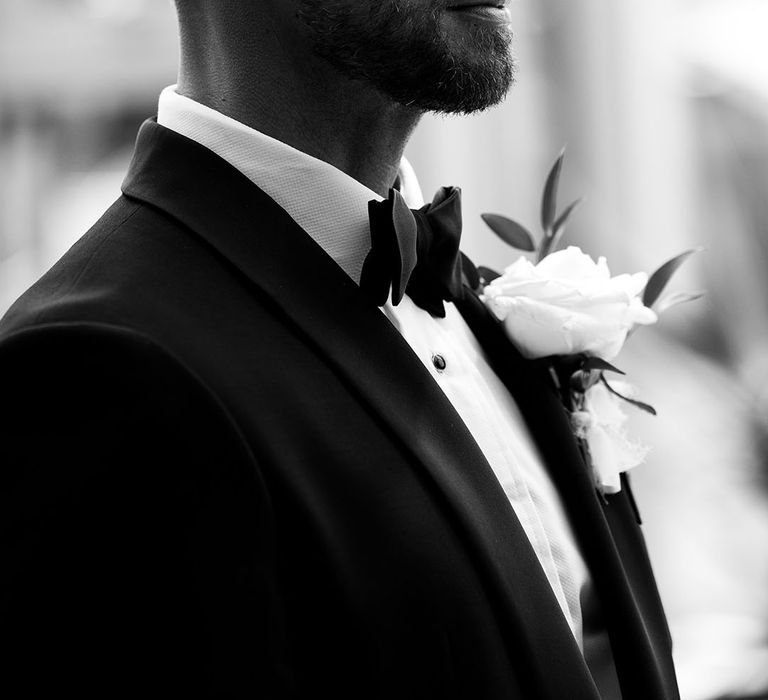 groom-with-short-hair-and-skin-fade-wearing-black-tuxedo