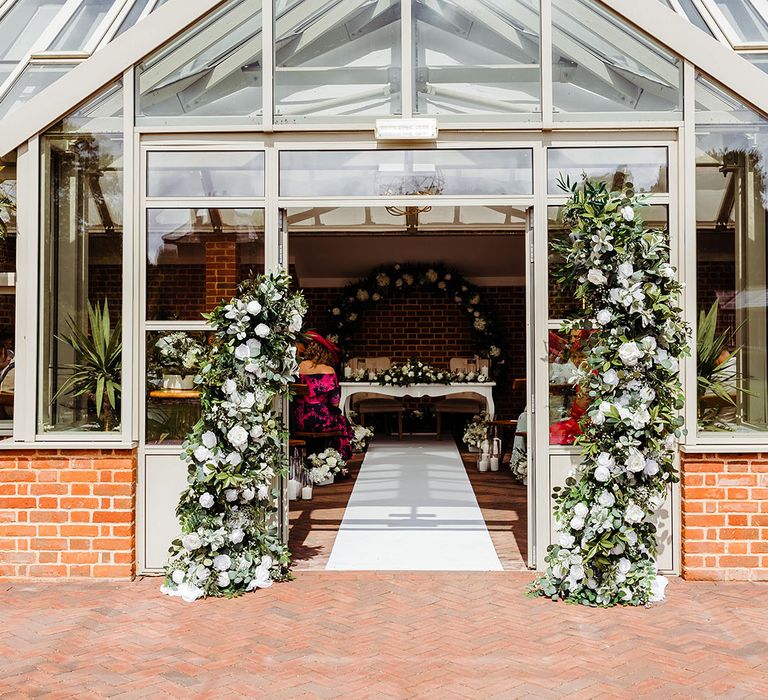 white-flower-wedding-flower-columns-entrance-decorations