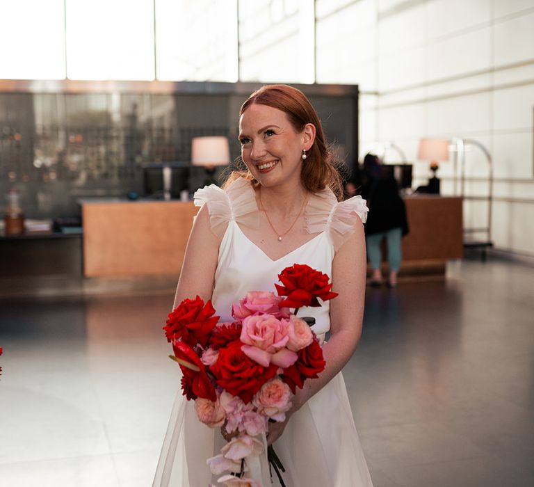 bride-in-halfpenny-london-wedding-dress-with-pink-and-red-bouquet