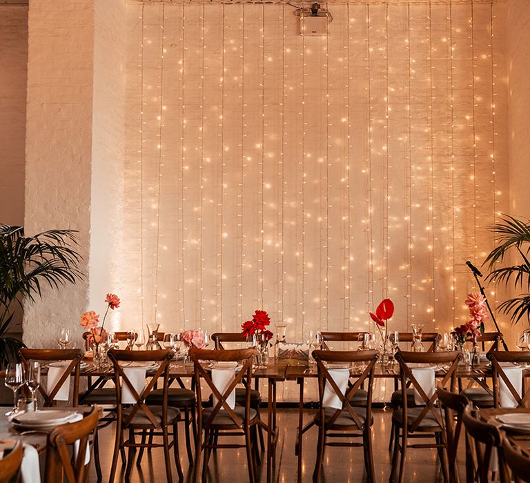 fairy-lights-behind-top-table-at-wedding-venue