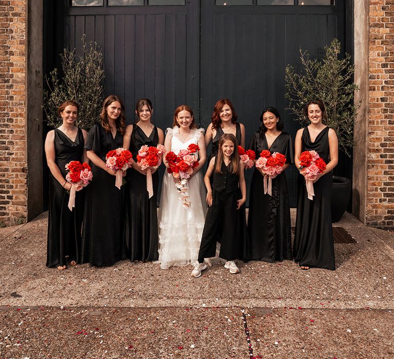 six-stories-black-bridesmaid-dresses-with-pink-and-red-wedding-bouquets