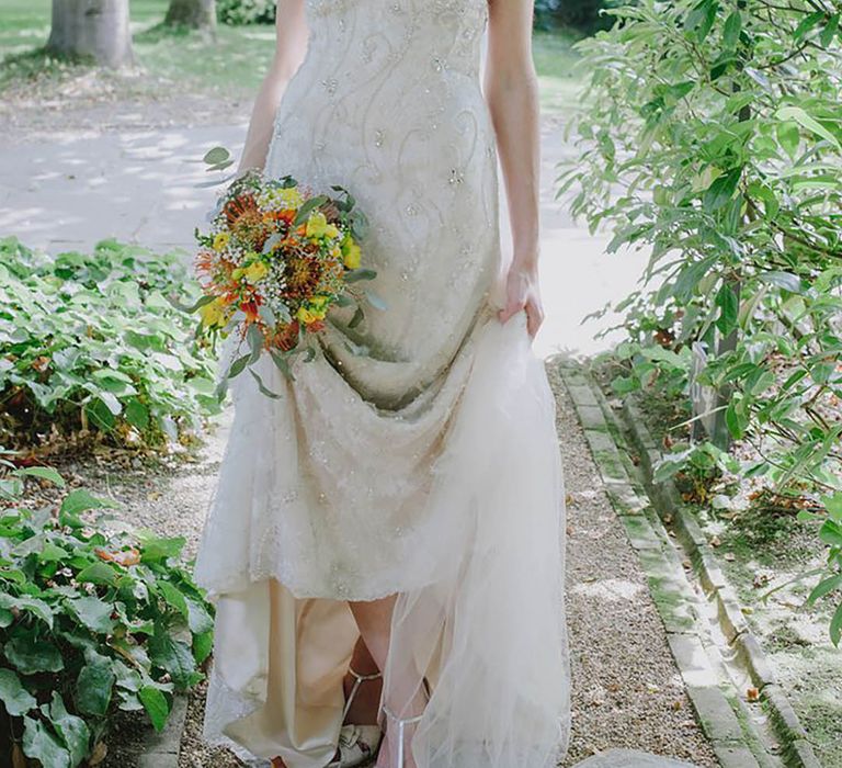 bride wearing beaded vintage wedding dress