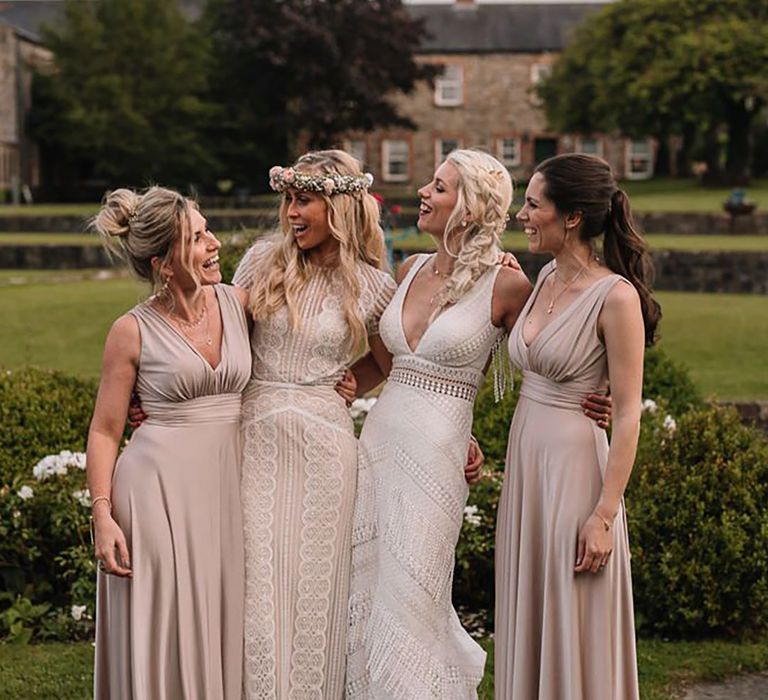 bride with her bridesmaids wearing champagne bridesmaid dresses at Ireland wedding venue