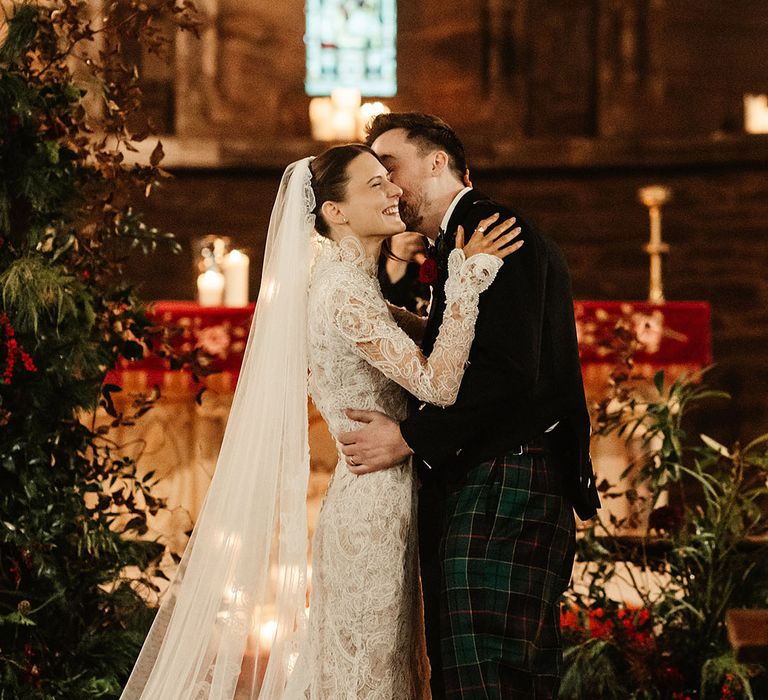 bride-and-groom-share-a-kiss-at-wedding