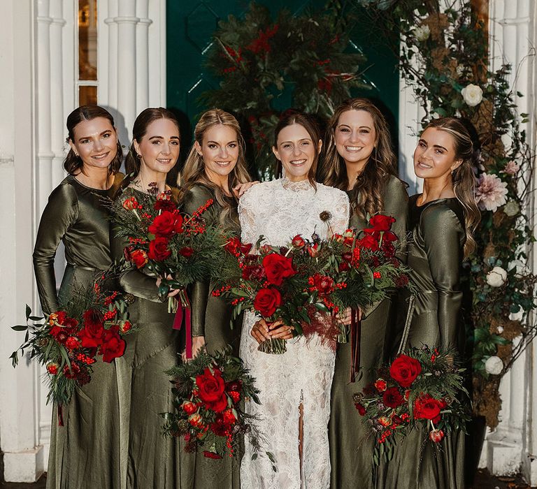 bridesmaids-wearing-olive-green-bridesmaid-dresses-with-red-rose-bouquets