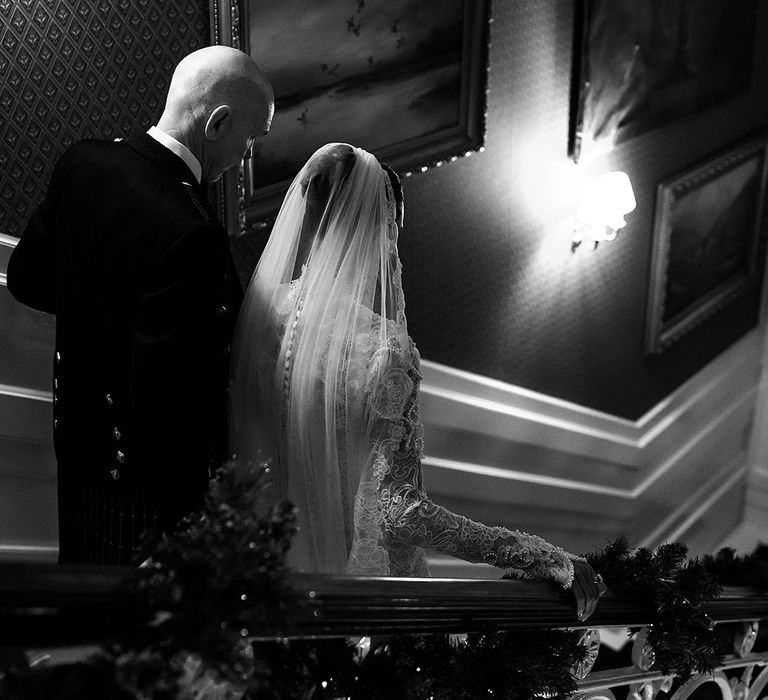 father-of-the-bride-walking-bride-down-staircase