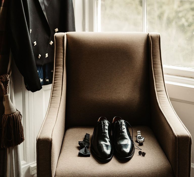 groom-accessories-on-armchair